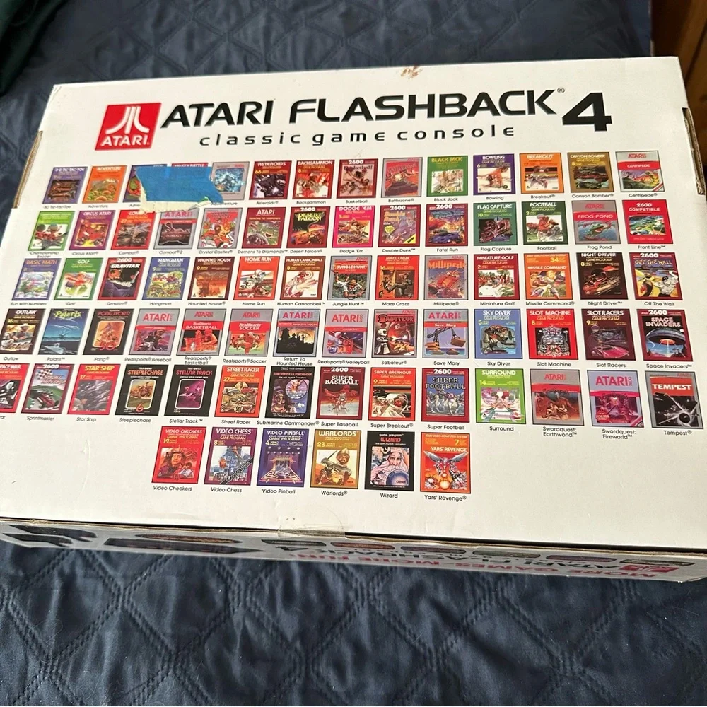 Original in the box, never opened Atari with 76 games.